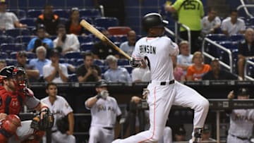 MIAMI, FL - SEPTEMBER 17: Lewis Brinson #9 of the Miami Marlins hits an RBI single in the seventh inning against the Washington Nationals at Marlins Park on September 17, 2018 in Miami, Florida. (Photo by Eric Espada/Getty Images)