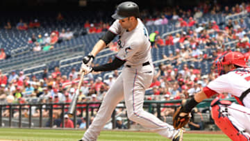 WASHINGTON, DC - MAY 27: Neil Walker #18 of the Miami Marlins singles in Garret Cooper #26 (not pictured) in the third inning during a baseball game against the Washington Nationals at Nationals Park on May 27, 2019 in Washington. DC. (Photo by Mitchell Layton/Getty Images)