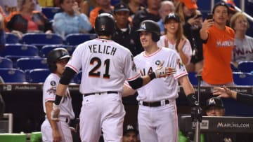 Christian Yelich #21 of the Miami Marlins is congratulated by J.T. Realmuto #11 after hitting a home run in the fourth inning against the New York Mets at Marlins Park. (Photo by Eric Espada/Getty Images)