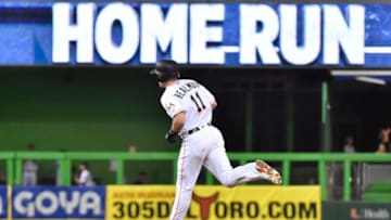 MIAMI, FL - JUNE 11: J.T. Realmuto #11 of the Miami Marlins rounds second base after hitting a home run in the seventh inning against the San Francisco Giants at Marlins Park on June 11, 2018 in Miami, Florida. (Photo by Eric Espada/Getty Images)