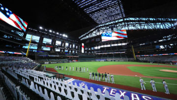 ARLINGTON, TEXAS - AUGUST 26: A view as the Oakland Athletics and the Texas Rangers stand during the National Anthem before a Major League baseball game at Globe Life Field on August 26, 2020 in Arlington, Texas. (Photo by Tom Pennington/Getty Images)