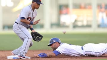 KANSAS CITY, MO - JULY 19: Alex Gordon #4 of the Kansas City Royals slides into second for a steal as Ramon Santiago #39 of the Detroit Tigers fields the throw in the first inning during a game at Kauffman Stadium on July 19, 2013 in Kansas City, Missouri. (Photo by Ed Zurga/Getty Images)