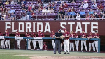 TALLAHASSEE, FL - MARCH 9: Head Coach Mike Martin of the Florida State Seminoles talk with Umpire Perry Costello about a change in the line-up during the game against Virginia Tech on Mike Martin Field at Dick Howser Stadium on March 9, 2019 in Tallahassee. FSU's CJ Van Eyk would be a great option for the Detroit Tigers in the 2020 MLB Draft. (Photo by Don Juan Moore/Getty Images)