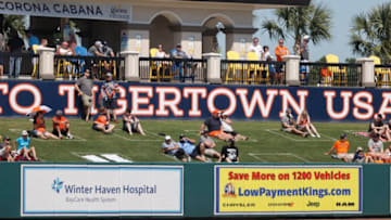 Mar 4, 2021; Lakeland, Florida, USA; Fans sit in the outfield lawn as they watch the spring training game between the Detroit Tigers and Toronto Blue Jays at Publix Field at Joker Marchant Stadium. Mandatory Credit: Kim Klement-USA TODAY Sports