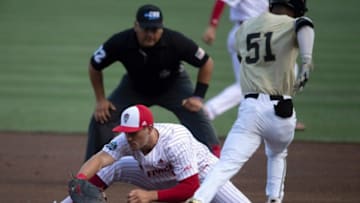 NC State first baseman Austin Murr stretches to make the out.