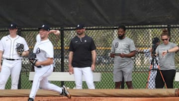 Gabe Ribas director of pitching, Tim Smith and Georgia Giblin watch as Detroit Tigers right handed pitching prospect throws during spring training Minor League minicamp Tuesday, Feb.22, 2022 at Tiger Town in Lakeland.Tigers6