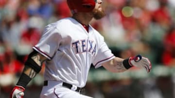 Oct 3, 2015; Arlington, TX, USA; Texas Rangers left fielder Josh Hamilton (32) follows through on his solo home run against the Los Angeles Angels during the second inning of a baseball game at Globe Life Park in Arlington. Mandatory Credit: Jim Cowsert-USA TODAY Sports