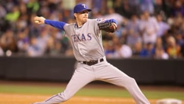 Jul 20, 2015; Denver, CO, USA; Texas Rangers relief pitcher Tanner Scheppers (52) delivers a pitch during the ninth inning against the Colorado Rockies at Coors Field. The Rockies won 8-7. Mandatory Credit: Chris Humphreys-USA TODAY Sports