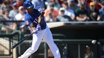 Mar 12, 2016; Surprise, AZ, USA; Texas Rangers third baseman Adrian Beltre (29) swings the bat against the Oakland Athletics during the first inning at Surprise Stadium. Mandatory Credit: Joe Camporeale-USA TODAY Sports