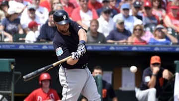 Mar 18, 2016; Jupiter, FL, USA; Detroit Tigers catcher Bryan Holaday (50) connects for an RBI fielders choice against the St. Louis Cardinals during the game at Roger Dean Stadium. The Tigers defeated the Cardinals 2-0. Mandatory Credit: Scott Rovak-USA TODAY Sports