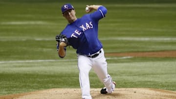 Mar 18, 2016; San Antonio, TX, USA; Texas Rangers starting pitcher Derek Holland (45) throws to the plate during the first inning against the Kansas City Royals at Alamodome. Mandatory Credit: Soobum Im-USA TODAY Sports