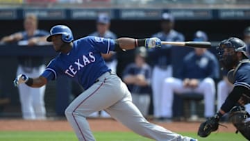 Mar 22, 2016; Peoria, AZ, USA; Texas Rangers second baseman Hanser Alberto (2) hits a pitch during the second inning against the San Diego Padres at Peoria Sports Complex. Mandatory Credit: Joe Camporeale-USA TODAY Sports