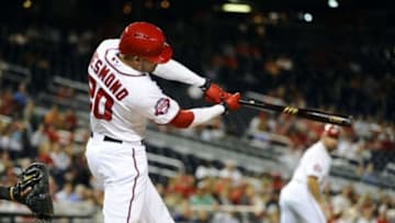 Sep 17, 2015; Washington, DC, USA; Washington Nationals shortstop Ian Desmond (20) hits a two run home run against the Miami Marlins during the second inning at Nationals Park. Mandatory Credit: Brad Mills-USA TODAY Sports