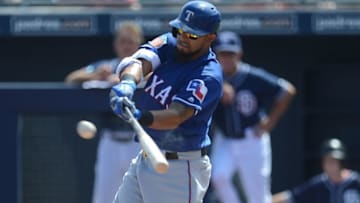 Mar 22, 2016; Peoria, AZ, USA; Texas Rangers second baseman Rougned Odor (12) hits an RBI double during the first inning against the San Diego Padres at Peoria Sports Complex. Mandatory Credit: Joe Camporeale-USA TODAY Sports