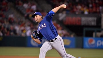 Apr 7, 2016; Anaheim, CA, USA; Texas Rangers starting pitcher Derek Holland (45) delivers a pitch against the Los Angeles Angels during a MLB baseball game at Angel Stadium of Anaheim. Mandatory Credit: Kirby Lee-USA TODAY Sports