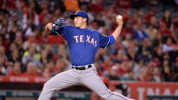Apr 7, 2016; Anaheim, CA, USA; Texas Rangers starting pitcher Derek Holland (45) delivers a pitch against the Los Angeles Angels during a MLB baseball game at Angel Stadium of Anaheim. Mandatory Credit: Kirby Lee-USA TODAY Sports