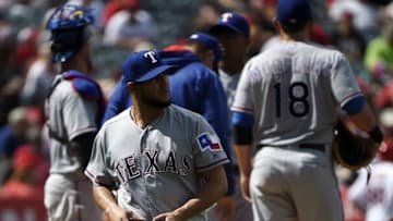 Apr 10, 2016; Anaheim, CA, USA; Texas Rangers pitcher Martin Perez (33) walks to the dugout after being taken out during the seventh inning against the Los Angeles Angels at Angel Stadium of Anaheim. Mandatory Credit: Kelvin Kuo-USA TODAY Sports