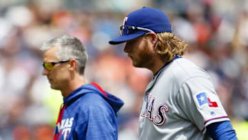 May 7, 2016; Detroit, MI, USA; Texas Rangers starting pitcher A.J. Griffin (64) walks off the field with the trainer during the third inning against the Detroit Tigers at Comerica Park. Mandatory Credit: Rick Osentoski-USA TODAY Sports