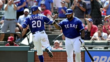 May 11, 2016; Arlington, TX, USA; Texas Rangers center fielder Ian Desmond (20) celebrates with designated hitter Prince Fielder (84) after scoring during the sixth inning against the Chicago White Sox at Globe Life Park in Arlington. Mandatory Credit: Kevin Jairaj-USA TODAY Sports