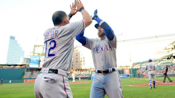 Aug 4, 2016; Baltimore, MD, USA; Texas Rangers catcher Jonathan Lucroy (25) high fives second baseman Rougned Odor (12) after hitting a home run in the second inning against the Baltimore Orioles at Oriole Park at Camden Yards. Mandatory Credit: Evan Habeeb-USA TODAY Sports