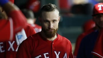 Aug 17, 2016; Arlington, TX, USA; Texas Rangers catcher Jonathan Lucroy (25) in the dugout after hitting a home run in the fourth inning against the Oakland Athletics at Globe Life Park in Arlington. Mandatory Credit: Tim Heitman-USA TODAY Sports