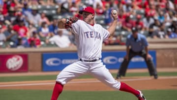 Aug 28, 2016; Arlington, TX, USA; Texas Rangers starting pitcher Derek Holland (45) pitches against the Cleveland Indians during the first inning at Globe Life Park in Arlington. Mandatory Credit: Jerome Miron-USA TODAY Sports