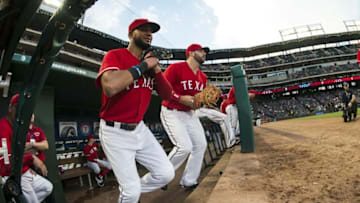 Sep 19, 2016; Arlington, TX, USA; Texas Rangers right fielder Nomar Mazara (30) and first baseman Mitch Moreland (18) take the field to face the Los Angeles Angels at Globe Life Park in Arlington. Mandatory Credit: Jerome Miron-USA TODAY Sports
