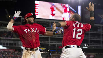 Sep 19, 2016; Arlington, TX, USA; Texas Rangers shortstop Elvis Andrus (1) and second baseman Rougned Odor (12) celebrate Andrus