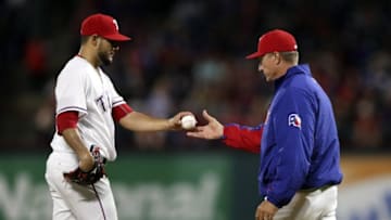 Sep 26, 2016; Arlington, TX, USA; Texas Rangers manager Jeff Banister (right) takes out starting pitcher Martin Perez (33) during the seventh inning against the Milwaukee Brewers at Globe Life Park in Arlington. Mandatory Credit: Kevin Jairaj-USA TODAY Sports