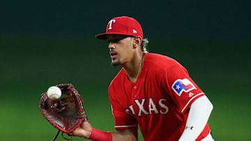 ARLINGTON, TEXAS - JUNE 08: Ronald Guzman #11 of the Texas Rangers catches a ball hit by Josh Phegley #19 of the Oakland Athletics in the eighth inning during game two of a doubleheader at Globe Life Park in Arlington on June 08, 2019 in Arlington, Texas. (Photo by Richard Rodriguez/Getty Images)