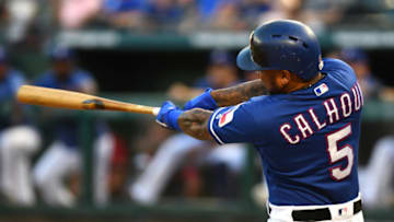 ARLINGTON, TEXAS - AUGUST 29: Willie Calhoun #5 of the Texas Rangers hits a home run against the Seattle Mariners in the bottom of the first inning at Globe Life Park in Arlington on August 29, 2019 in Arlington, Texas. (Photo by C. Morgan Engel/Getty Images)