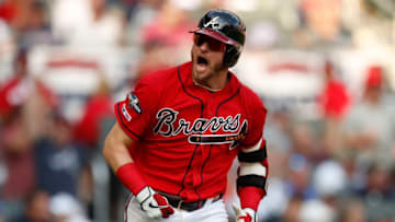 ATLANTA, GEORGIA - OCTOBER 04: Josh Donaldson #20 of the Atlanta Braves reacts after an RBI single off Jack Flaherty #22 of the St. Louis Cardinals in the first inning in game two of the National League Division Series at SunTrust Park on October 04, 2019 in Atlanta, Georgia. (Photo by Todd Kirkland/Getty Images)