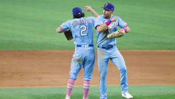 ARLINGTON, TX - MAY 9: Charlie Culberson #2 of the Texas Rangers and teammate Nate Lowe #30 celebrate the teams 10-2 win over the Seattle Mariners at Globe Life Field on May 9, 2021 in Arlington, Texas. (Photo by Ron Jenkins/Getty Images)