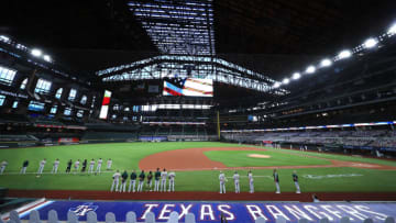 ARLINGTON, TEXAS - AUGUST 26: A view as the Oakland Athletics and the Texas Rangers stand during the National Anthem before a Major League baseball game at Globe Life Field on August 26, 2020 in Arlington, Texas. (Photo by Tom Pennington/Getty Images)