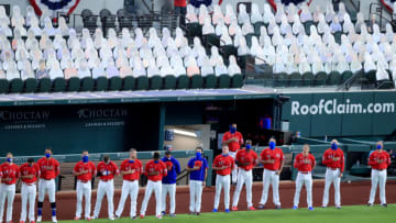 ARLINGTON, TEXAS - AUGUST 28: Members of the Texas Rangers stand during the National Anthem before a MLB baseball game against the Los Angeles Dodgers at Globe Life Field on August 28, 2020 in Arlington, Texas. All players are wearing #42 in honor of Jackie Robinson Day. The day honoring Jackie Robinson, traditionally held on April 15, was rescheduled due to the COVID-19 pandemic.” (Photo by Tom Pennington/Getty Images)