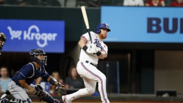 ARLINGTON, TEXAS - MAY 30: Kole Calhoun #56 of the Texas Rangers bats in the game against the Tampa Bay Rays at Globe Life Field on May 30, 2022 in Arlington, Texas. (Photo by Tim Heitman/Getty Images)