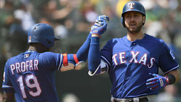 OAKLAND, CA - APRIL 19: Joey Gallo #13 of the Texas Rangers is congratulated by teammate Jurickson Profar on his solo home run against the Oakland Athletics in the top of the fifth inning at Oakland Alameda Coliseum on April 19, 2017 in Oakland, California. (Photo by Thearon W. Henderson/Getty Images)