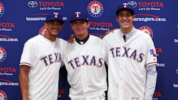 ARLINGTON, TX - JUNE 16: (L-R) Bubba Thompson from McGill-Toolen High School, Chris Seise out of West Orange High School and right-handed pitcher Hans Crouse out of Dana Hills High School pose for a photo after the Texas Rangers announced the signings of several of the club's top selections in the 2017 Major League Baseball Draft at Globe Life Park in Arlington on June 16, 2017 in Arlington, Texas. (Photo by Tom Pennington/Getty Images)