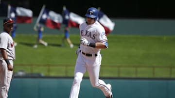 ARLINGTON, TX - MAY 6: Ryan Rua #16 of the Texas Rangers rounds the bases after hitting a solo home run against the Boston Red Sox during the seventh inning at Globe Life Park in Arlington on May 6, 2018 in Arlington, Texas. The Red Sox won 6-1. (Photo by Ron Jenkins/Getty Images)