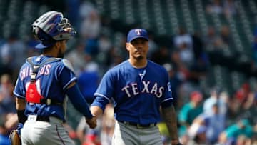 SEATTLE, WA - MAY 16: Robinson Chirinos #61 of the Texas Rangers greets Keone Kela #50 after he secured the win against the Seattle Mariners at Safeco Field on May 16, 2018 in Seattle, Washington. The Texas Rangers beat the Seattle Mariners 5-1. (Photo by Lindsey Wasson/Getty Images)