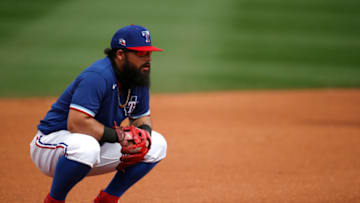 SURPRISE, ARIZONA - MARCH 07: Third baseman Rougned Odor #12 of the Texas Rangers kneels down during the fourth inning of the MLB spring training baseball game against the Los Angeles Dodgers at Surprise Stadium on March 07, 2021 in Surprise, Arizona. (Photo by Ralph Freso/Getty Images)