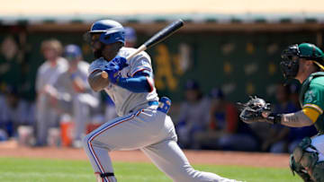OAKLAND, CALIFORNIA - SEPTEMBER 12: Adolis Garcia #53 of the Texas Rangers bats against the Oakland Athletics in the top of the first inning at RingCentral Coliseum on September 12, 2021 in Oakland, California. (Photo by Thearon W. Henderson/Getty Images)