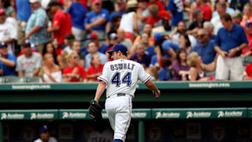 ARLINGTON, TX - JULY 08: Roy Oswalt #44 of the Texas Rangers walks off the field after thunder and a lightning strike during play against the Minnesota Twins at Rangers Ballpark in Arlington on July 8, 2012 in Arlington, Texas. (Photo by Ronald Martinez/Getty Images)