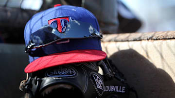 SURPRISE, AZ - FEBRUARY 27: A Texas Rangers Louisville glove and cap rest on the step to the dugout before the game against the Texas Rangers at Surprise Stadium on February 27, 2014 in Surprise, Arizona. (Photo by Mike McGinnis/Getty Images)