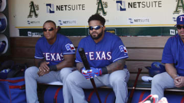 OAKLAND, CA - SEPTEMBER 24: Adrian Beltre #29 and Prince Fielder #84 of the Texas Rangers sit in the dugout prior to the game against the Oakland Athletics at O.co Coliseum on September 24, 2015 in Oakland, California. The Rangers defeated the Athletics 8-1. (Photo by Michael Zagaris/Oakland Athletics/Getty Images)