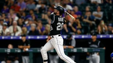 Jul 29, 2019; Denver, CO, USA; Colorado Rockies center fielder David Dahl (26) watches his ball on a two run home run in the eighth inning against the Los Angeles Dodgers at Coors Field. Mandatory Credit: Isaiah J. Downing-USA TODAY Sports