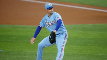 Jul 26, 2020; Arlington, Texas, USA; Texas Rangers starting pitcher Corey Kluber (28) throws a pitch in the first inning against the Colorado Rockies at Globe Life Field. Mandatory Credit: Tim Heitman-USA TODAY Sports
