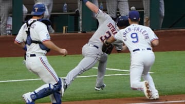 Sep 26, 2020; Arlington, Texas, USA; Houston Astros center fielder Myles Straw (3) is tagged by Texas Rangers third baseman Isiah Kiner-Falefa (9) in a run-down between third base and home as catcher Jeff Mathis (2) watches during the third inning at Globe Life Field. Mandatory Credit: Jim Cowsert-USA TODAY Sports