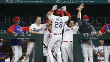 Apr 6, 2021; Arlington, Texas, USA; Texas Rangers catcher Jonah Heim (28) is congratulated by his teammates after hitting his first major league home run in the sixth inning against the Toronto Blue Jays at Globe Life Field. Mandatory Credit: Tim Heitman-USA TODAY Sports