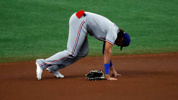 Apr 12, 2021; St. Petersburg, Florida, USA; Texas Rangers left fielder Ronald Guzman (11) reacts after suffering an apparent injury during the first inning against the Tampa Bay Rays at Tropicana Field. Guzman left the game after the play. Mandatory Credit: Kim Klement-USA TODAY Sports